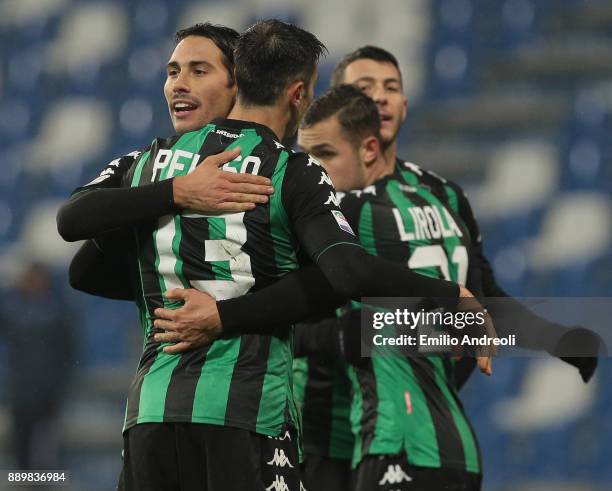 Edoardo Goldaniga of US Sassuolo Calcio celebrates the victory with his team-mate Federico Peluso at the end of the Serie A match between US Sassuolo...