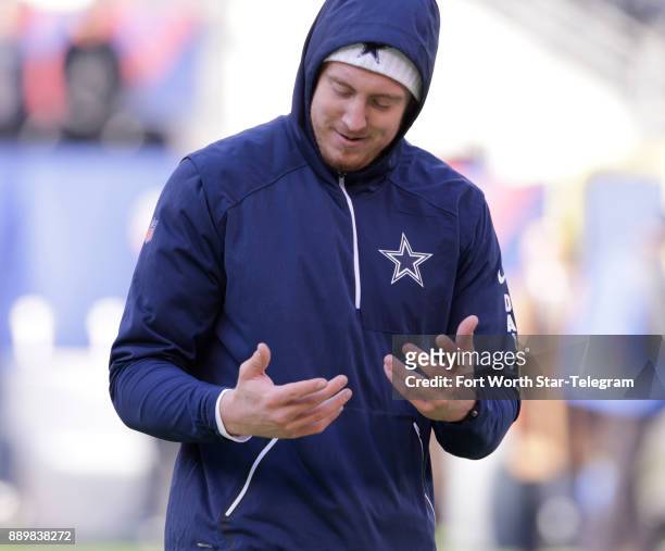 Dallas Cowboys tight end Blake Jarwin looks at his cold fingers after dropping a pass in pregame warmups before a game against the New York Giants on...