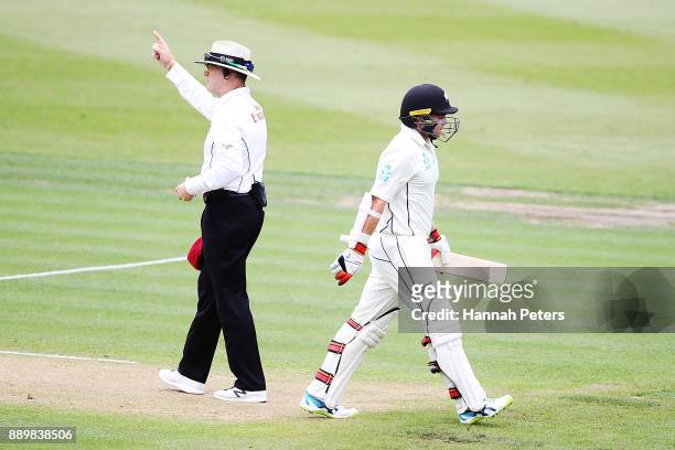 Tom Latham of New Zealand walks off after being given out lbw by Raymon Reifer of the West Indies during day three of the Second Test Match between...