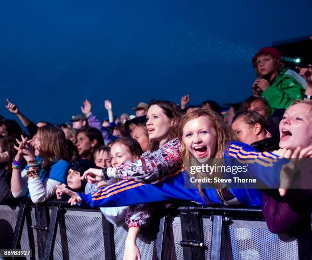 Fans cheering for Scouting For Girls performing on stage on the first day of Cornbury Festival on July 11, 2009 near Charlbury, United Kingdom.