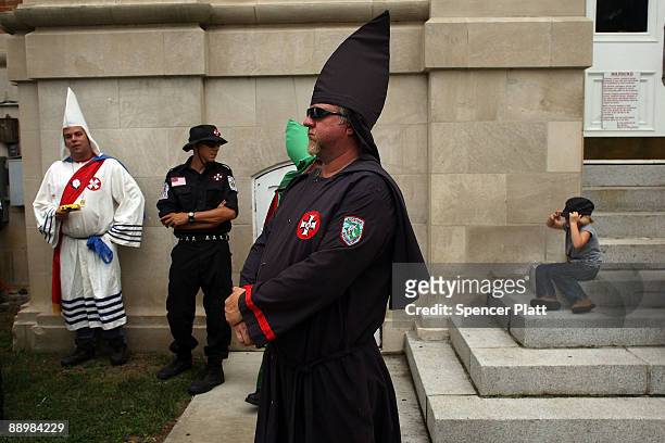Members of the Fraternal White Knights of the Ku Klux Klan participate in the 11th Annual Nathan Bedford Forrest Birthday march July 11, 2009 in...