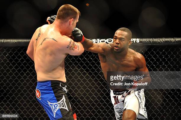 Jon Jones connects with a right punch on Jake O'Brein during their light heavyweight bout during UFC 100 on July 11, 2009 in Las Vegas, Nevada. Jones...