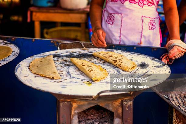 mexican quesadillas being made in a comal - oaxaca stock pictures, royalty-free photos & images