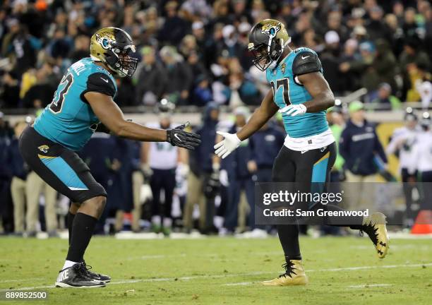 Leonard Fournette and Calais Campbell of the Jacksonville Jaguars celebrate after Fournette ran for a touchdown during the second half of their game...