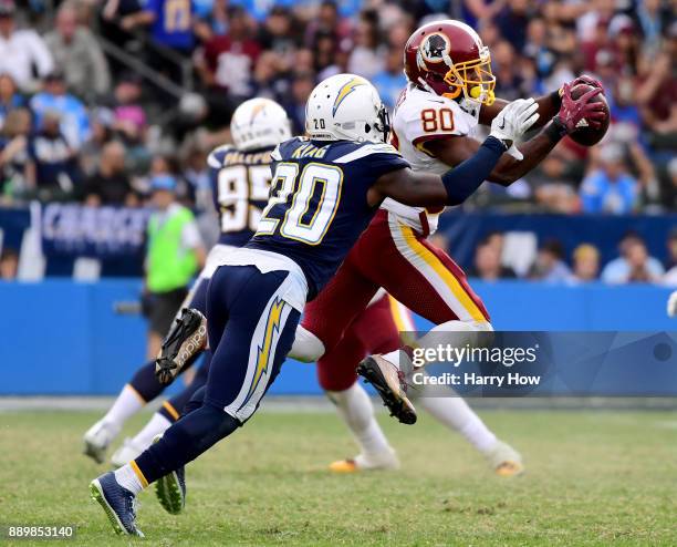 Jamison Crowder of the Washington Redskins makes a catch in front of Desmond King of the Los Angeles Chargers during the fourth quarter in a 30-13...