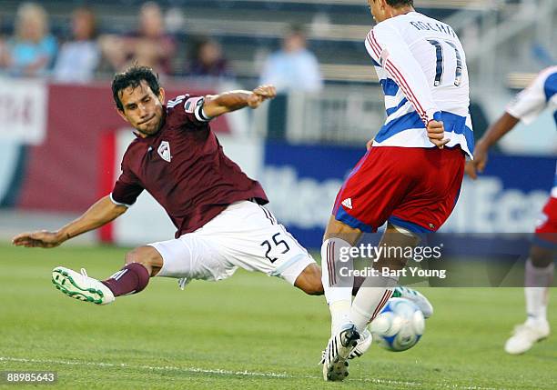 Pablo Mastroeni of the Colorado Rapids goes for the ball against Andre Rocha of the FC Dallas on July 11, 2009 at Dicks Sporting Goods Park in...