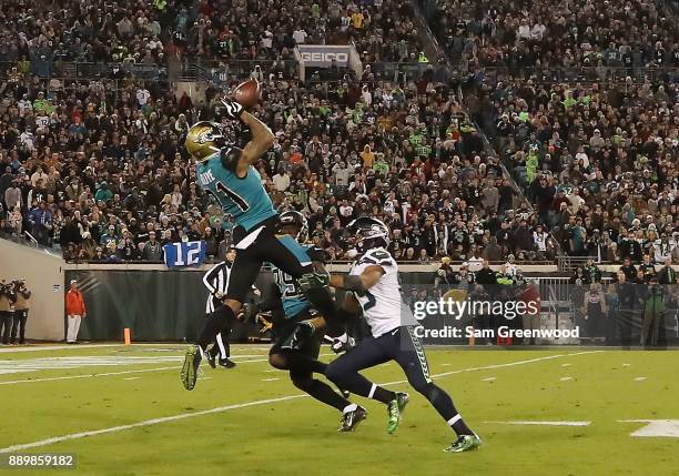 Bouye of the Jacksonville Jaguars leaps up to make an interception during the second half of their game against the Seattle Seahawks at EverBank...