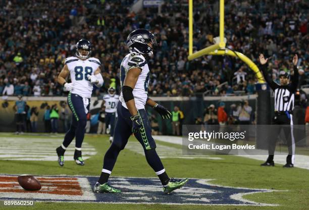 Doug Baldwin of the Seattle Seahawks celebrates after a 26-yard touchdown during the second half of their game against the Jacksonville Jaguars at...