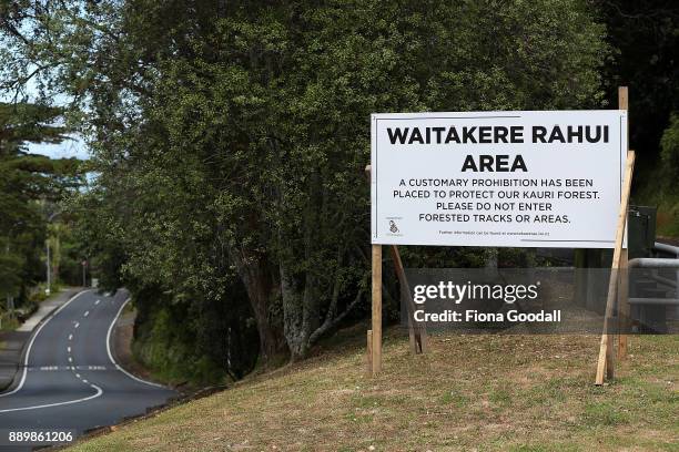 Rahui or customary prohibition sign in Titirangi, asks visitors not to enter tracks or forested areas in the Waitakere Ranges Regional Park on...