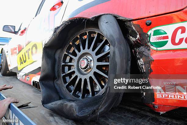 The shredded tyre on the Russell Ingall Supercheap Auto Racing Holden is seen after race 12 for round six of the V8 Supercar Championship Series at...