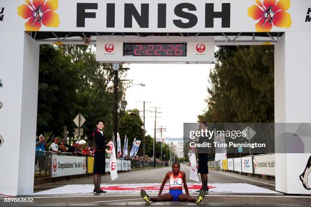 Bridgid Kosei of Kenya crosses the finish line to win the Women's division of the Honolulu Marathon 2017 on December 10, 2017 in Honolulu, Hawaii.