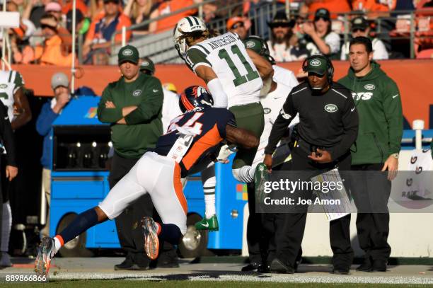 Denver Broncos defensive back Will Parks drives New York Jets wide receiver Robby Anderson out of bounds as the Broncos win over the New York Jets...