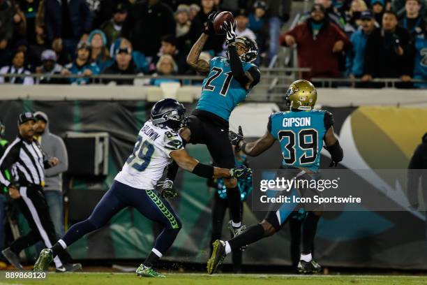 Jacksonville Jaguars cornerback A.J. Buoye intercepts a pass intended for Seattle Seahawks wide receiver Doug Baldwin during the game between the...