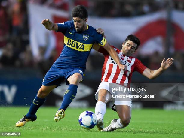 Pablo Perez of Boca Juniors fights for ball with Rodrigo Braña of Estudiantes during a match between Estudiantes and Boca Juniors as part of the...