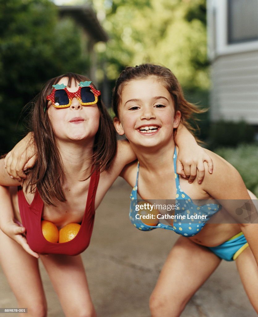 Girls Wearing Swimsuits With Oranges Stuffed In Bikini Tops High-Res Stock  Photo - Getty Images