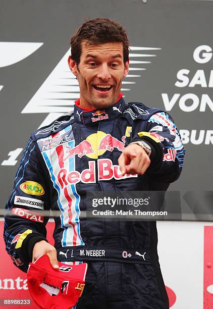 Mark Webber of Australia and Red Bull Racing celebrates on the podium after winning the German Formula One Grand Prix at Nurburgring on July 12, 2009...