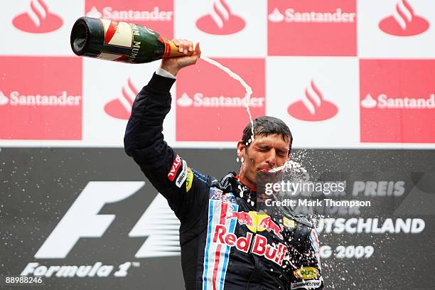 Mark Webber of Australia and Red Bull Racing celebrates on the podium after winning the German Formula One Grand Prix at Nurburgring on July 12, 2009...