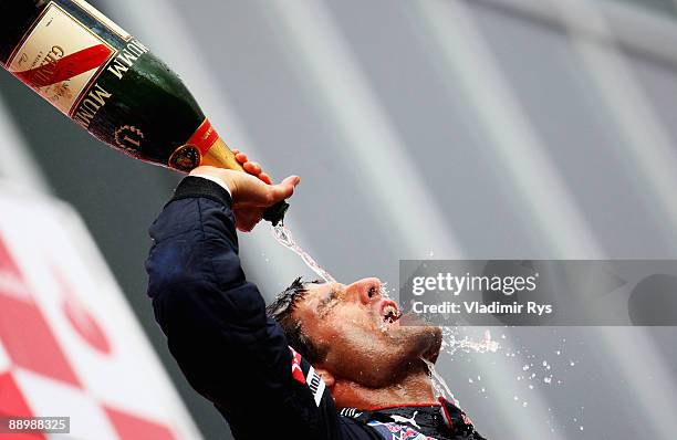 Mark Webber of Australia and Red Bull Racing celebrates on the podium after winning the German Formula One Grand Prix at Nurburgring on July 12, 2009...