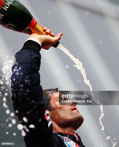 Mark Webber of Australia and Red Bull Racing celebrates on the podium after winning the German Formula One Grand Prix at Nurburgring on July 12, 2009...