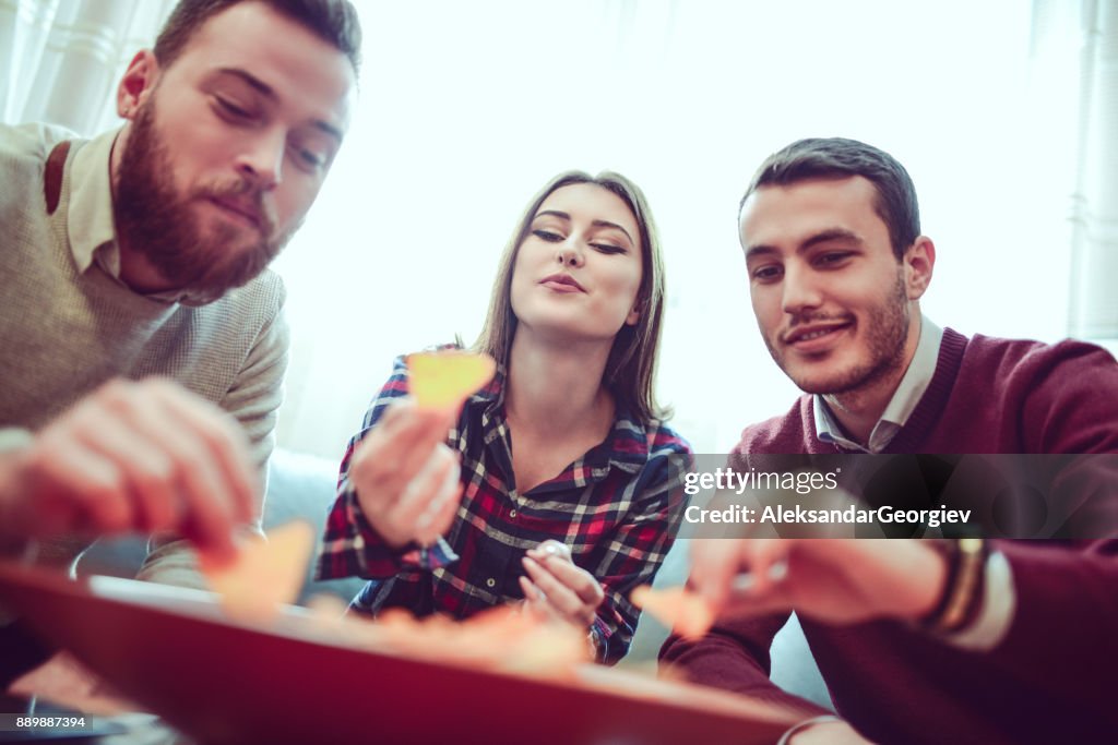Group of Friend Eating Snacks, Conversing and Having Fun Time Together