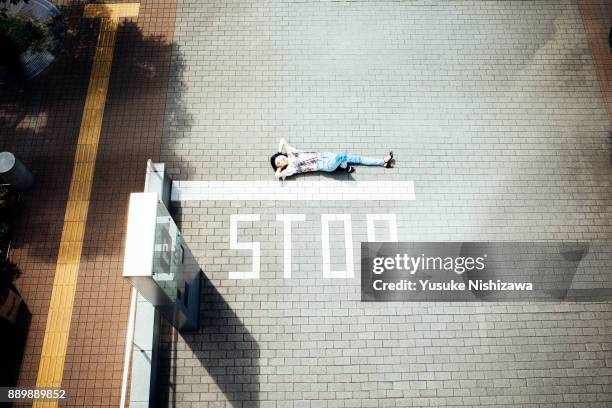 A woman lying on the road