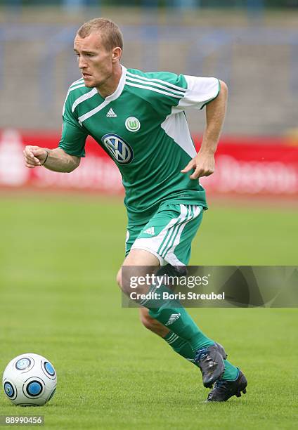 Thomas Kahlenberg of VfL Wolfsburg runs with the ball during the pre-season friendly match between Dessau and VfL Wolfsburg at the Paul-Greifzu...