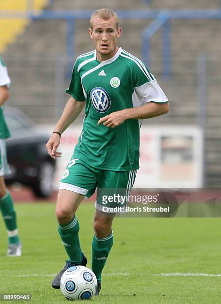 Thomas Kahlenberg of VfL Wolfsburg runs with the ball during the pre-season friendly match between Dessau and VfL Wolfsburg at the Paul-Greifzu...