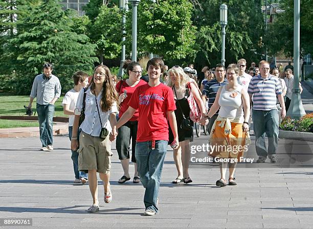 Protesters walk in mass through the Mormon owned Main Street Plaza July 12, 2009 in Salt Lake City, Utah. The protesters defied church security...