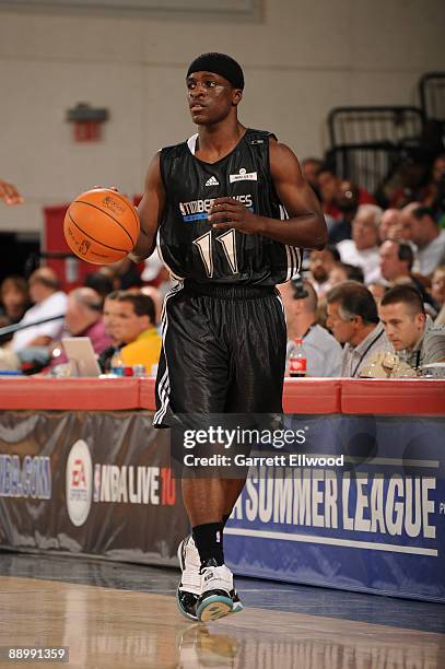 Jonny Flynn of the Minnesota Timberwolves brings the ball up court against the Houston Rockets during NBA Summer League presented by EA Sports on...