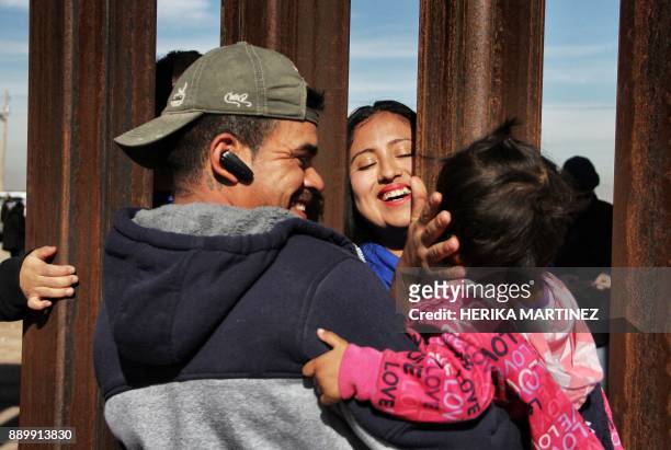 Members of a family reunite through the border wall between Mexico and United States, during the "Keep our dream alive" event, in Ciudad Juarez,...