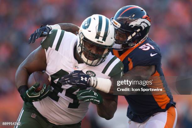 Denver Broncos linebacker Todd Davis tackles New York Jets fullback Lawrence Thomas during the New York Jets vs Denver Broncos football game at...