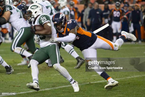 Denver Broncos linebacker Brandon Marshall tackles New York Jets running back Bilal Powell during the New York Jets vs Denver Broncos football game...