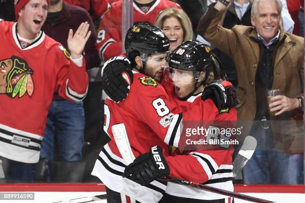 Nick Schmaltz and Patrick Kane of the Chicago Blackhawks celebrate after Schmaltz scored against the Arizona Coyotes in the third period at the...