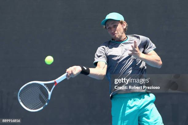 Maverick Banes of Australia competes against Matthew Barton of Australia in his first round Australian Open December Showdown match at Melbourne Park...