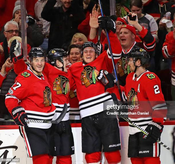 Lance Bouma, Tommy Wingels, John Hayden and Duncan Keith of the Chicago Blackhawks celebrate Wingels' third period goal against the Arizona Coyotes...