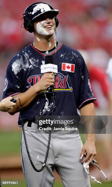 World Futures All-Star Rene Tosoni of the Minnesota Twins participates in a postgame interview after getting a pie in the face after winning MVP of...