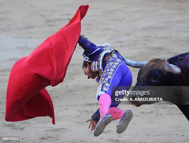 Spanish matador Rafael Rubio "Rafaelillo" is gored by a bull during a bullfight of the San Fermin festival, on July 12 in Pamplona, northern Spain....