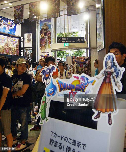 People wait for the sale of the newest series of the game software "Dragon Quest IX" at Tsutaya Shibuya on July 11, 2009 in Tokyo, Japan. The game...