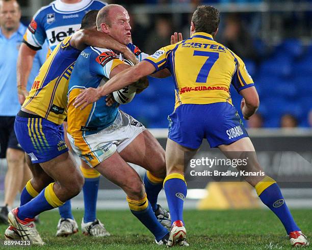Luke Bailey of the Titans takes on the Eels defence during the round 18 NRL match between the Gold Coast Titans and the Parramatta Eels at Skilled...