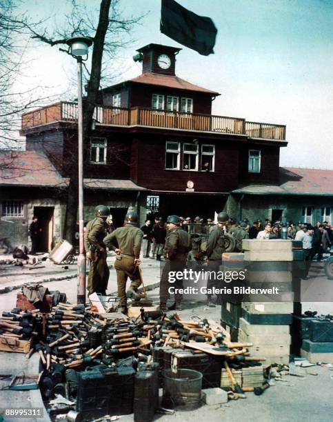Members of the US 5th Ranger Infantry Battalion outside the newly-liberated Buchenwald Concentration Camp, Germany, April 1945. In the foreground is...