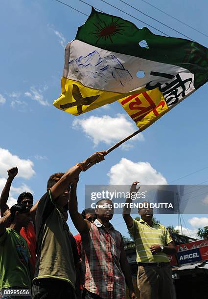 Indian supporters of the Gorkha People's Liberation Front shout slogans at Sukna village on the outskirts of Siliguri on July 13, 2009 on the first...