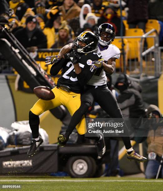 Artie Burns of the Pittsburgh Steelers breaks up a pass intended for Mike Wallace of the Baltimore Ravens in the third quarter during the game at...