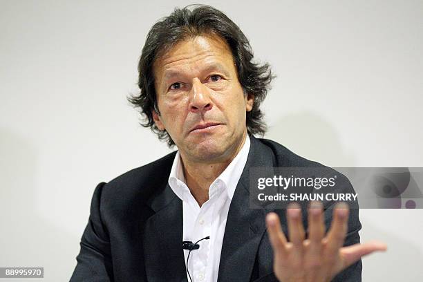 Former Pakistan cricketer and opposition politician Imran Khan talks to the media during a press conference in central London, on July 13, 2009....