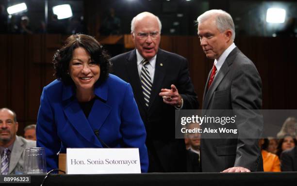 Supreme Court nominee Judge Sonia Sotomayor takes her seat with ranking member Sen. Jeff Sessions and committee chairman Sen. Patrick Leahy as she...