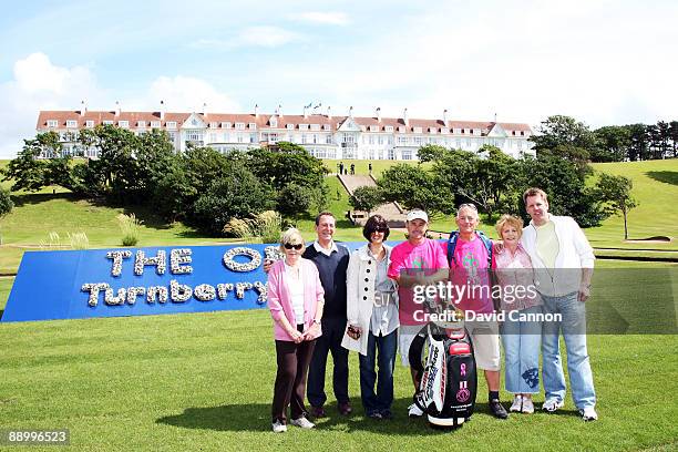 Billy Foster of England, Lee Westwood's caddie, with his companion Stuart Hooley and family members as he arrived at Turnberry after his charity walk...