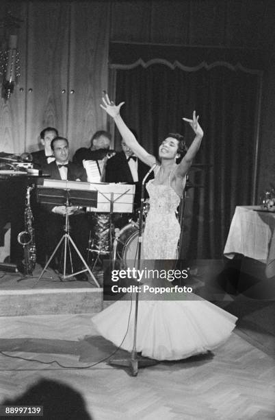 British pop singer Shirley Bassey and her backing musicians, 1957.