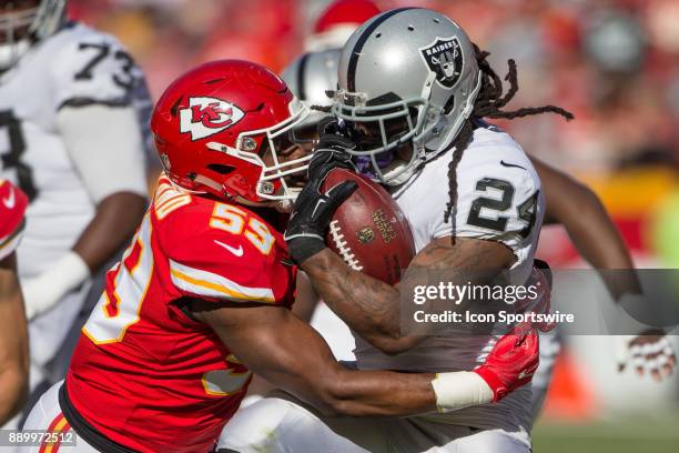 Kansas City Chiefs inside linebacker Reggie Ragland and Oakland Raiders running back Marshawn Lynch collide during the NFL AFC West Division game...