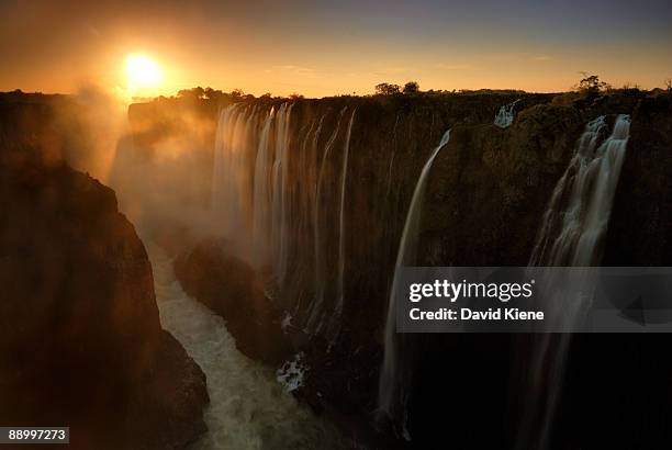 sunset at victoria falls, zambia - victoria falls sunset stock pictures, royalty-free photos & images