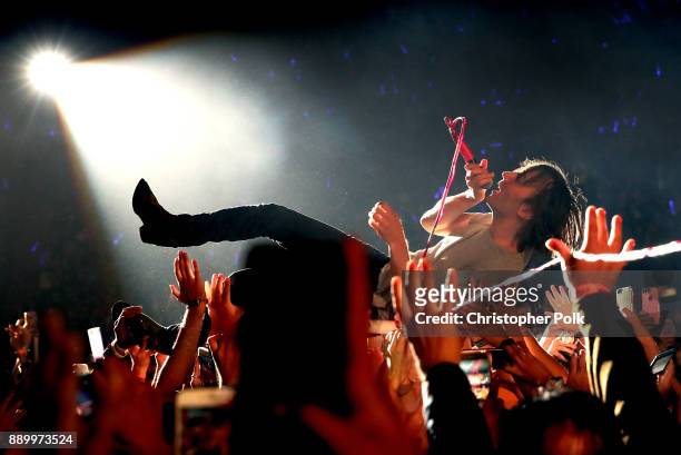 Thomas Mars of Phoenix crowdsurfs during KROQ Almost Acoustic Christmas 2017 at The Forum on December 10, 2017 in Inglewood, California.