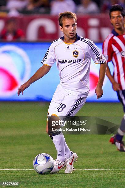 Mike Magee of the Los Angeles Galaxy looks to attack the defense of Chivas USA during the MLS game at The Home Depot Center on July 11, 2009 in...